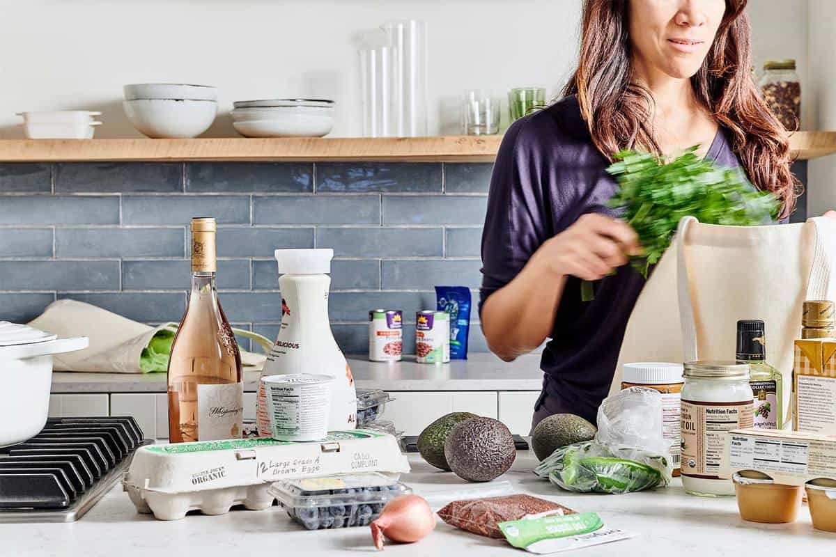 Women unpacking groceries